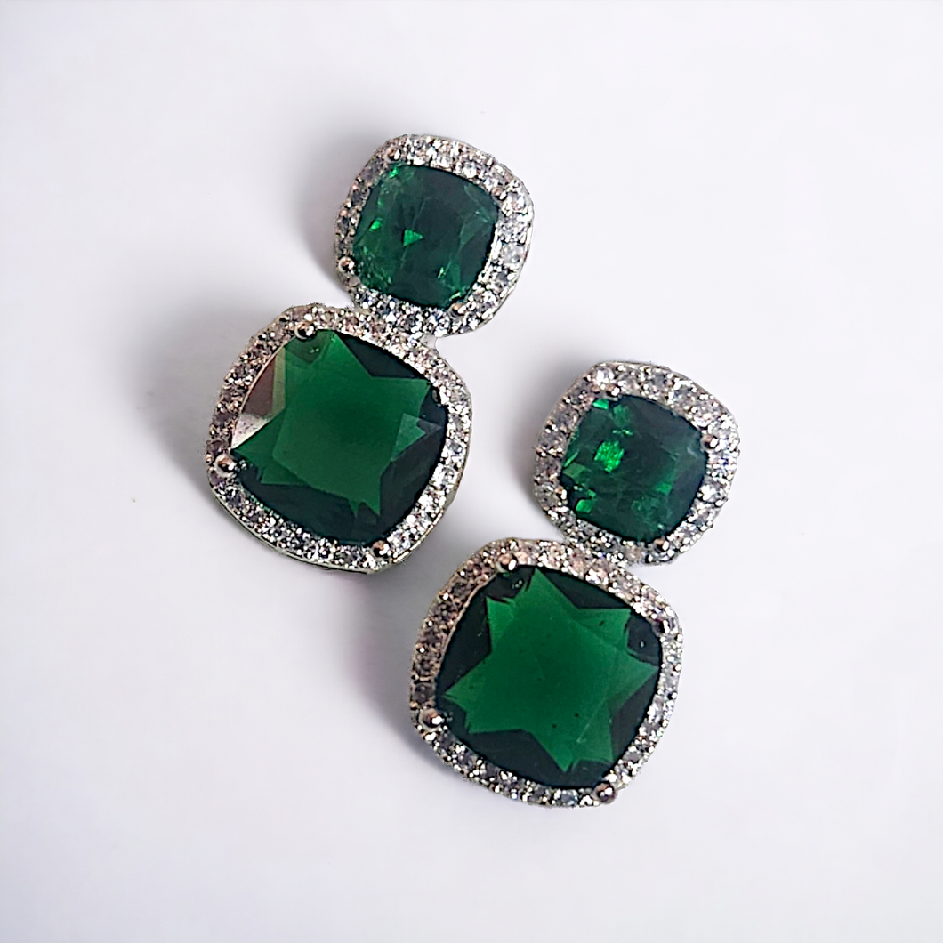 Emerald studded white gold earrings