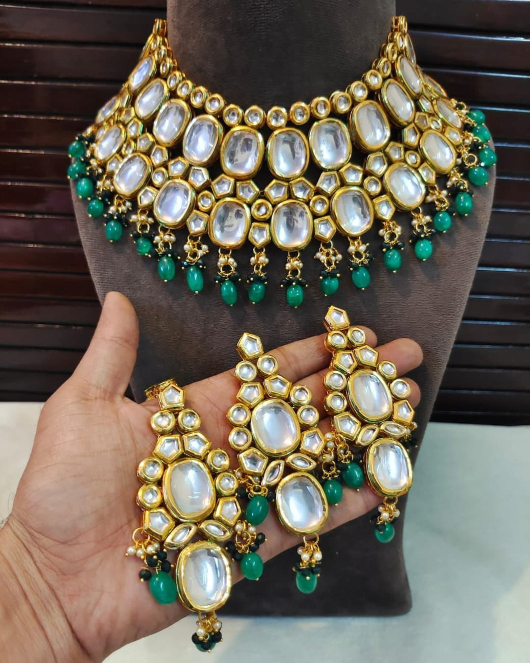 Green kundan set with earrings and maangtika